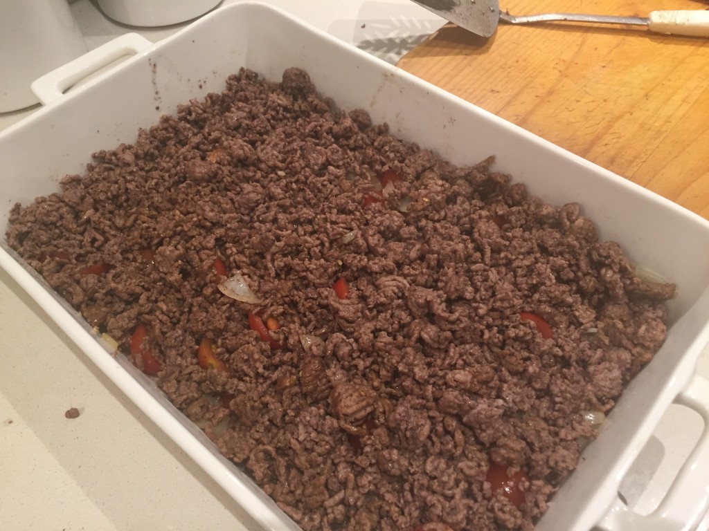 Putting the mince in the dish